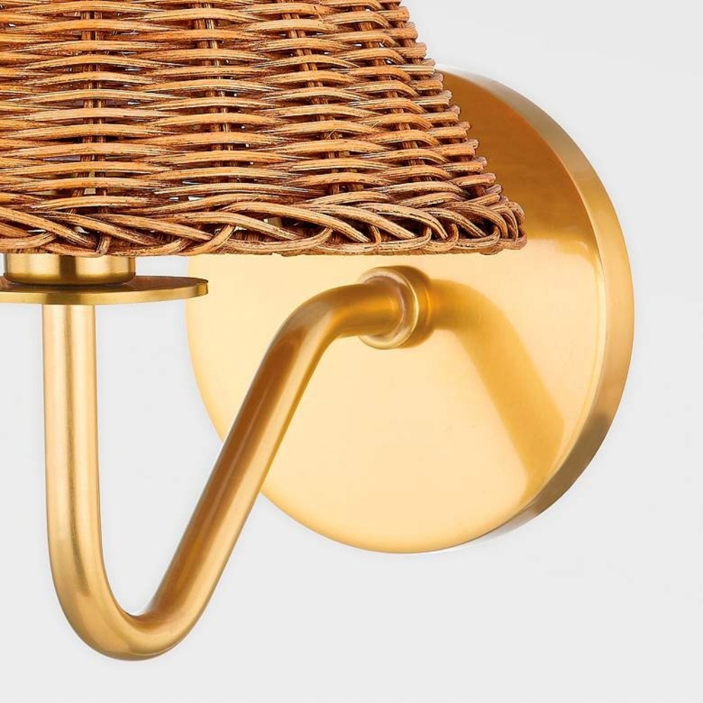 Metal construction with aged brass finish