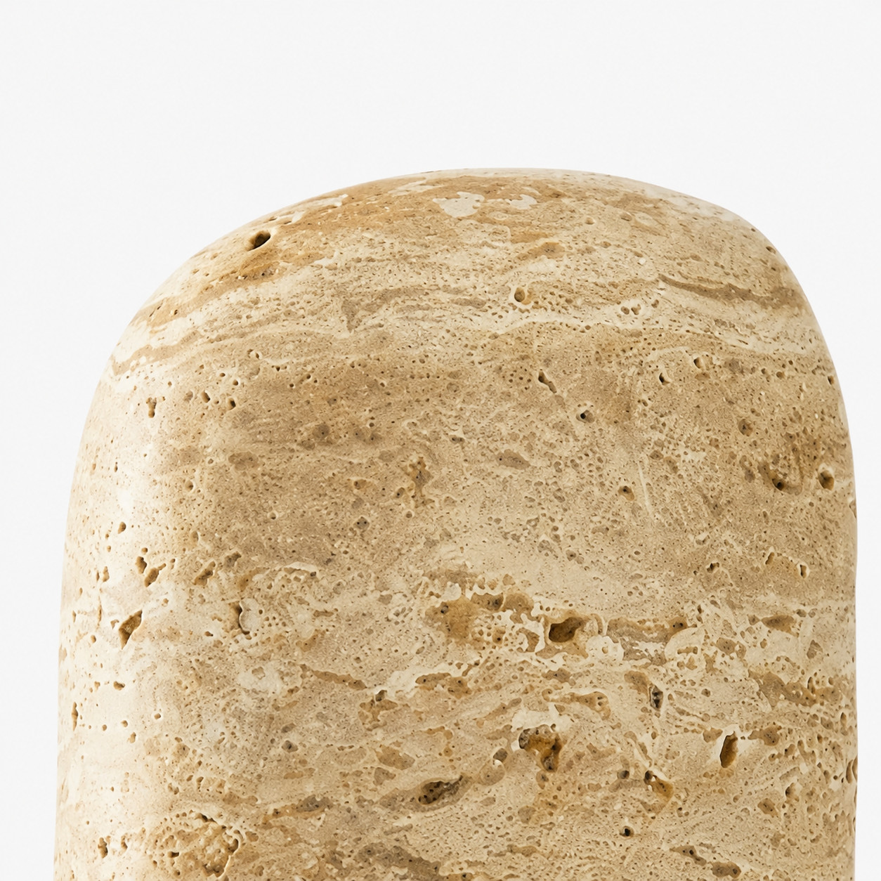 Close detail of rounded travertine shade top