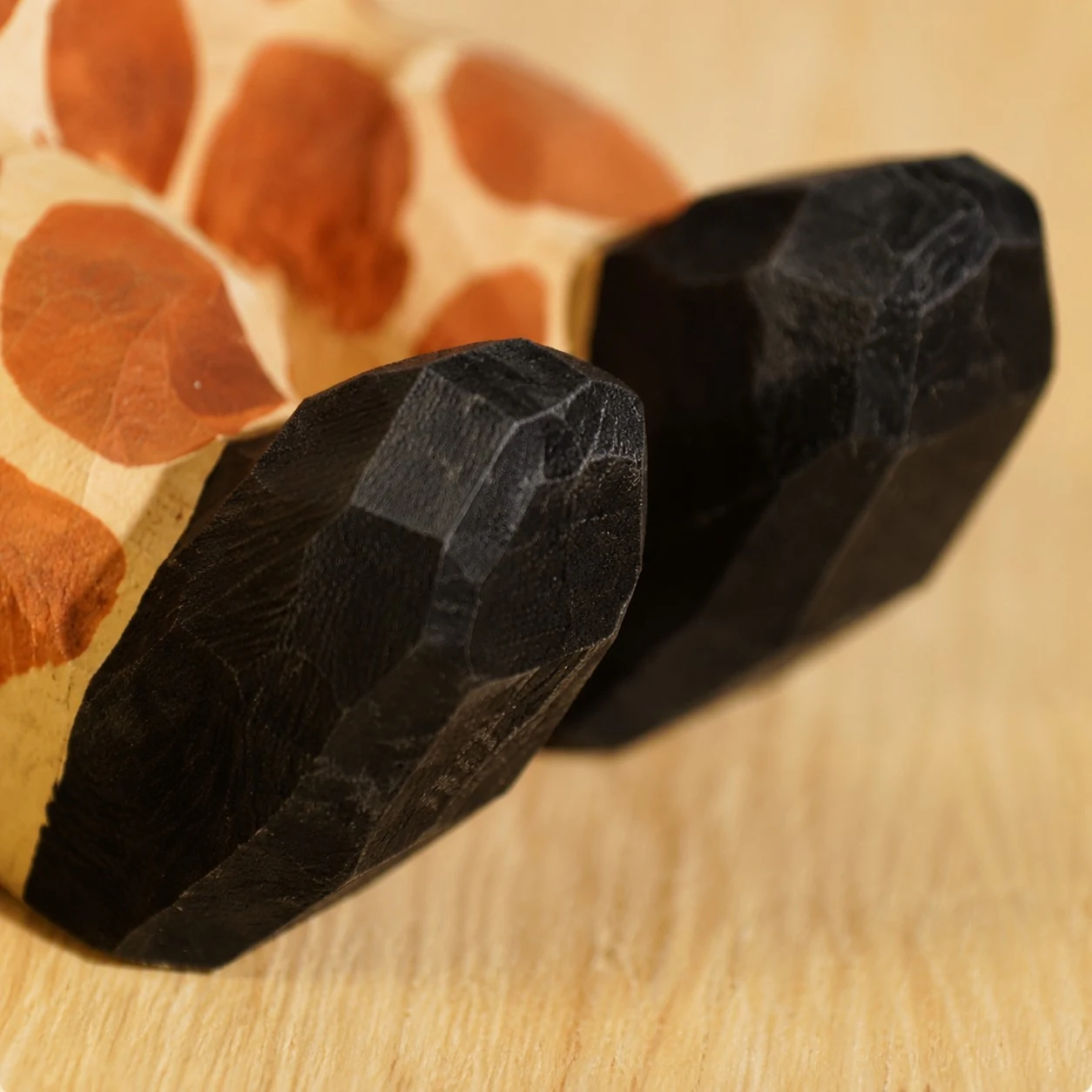 Carved wooden paw support detail