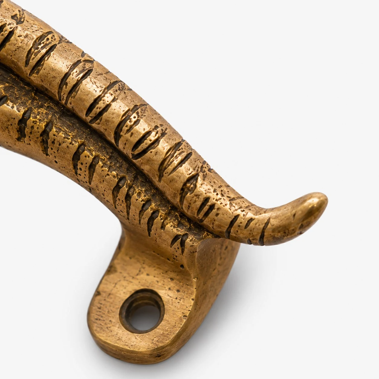 Handcrafted brass handle texture and carving detail