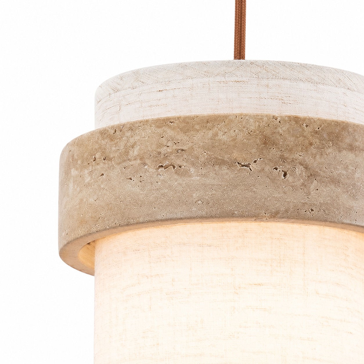 Front close-up of travertine ring and fabric shade