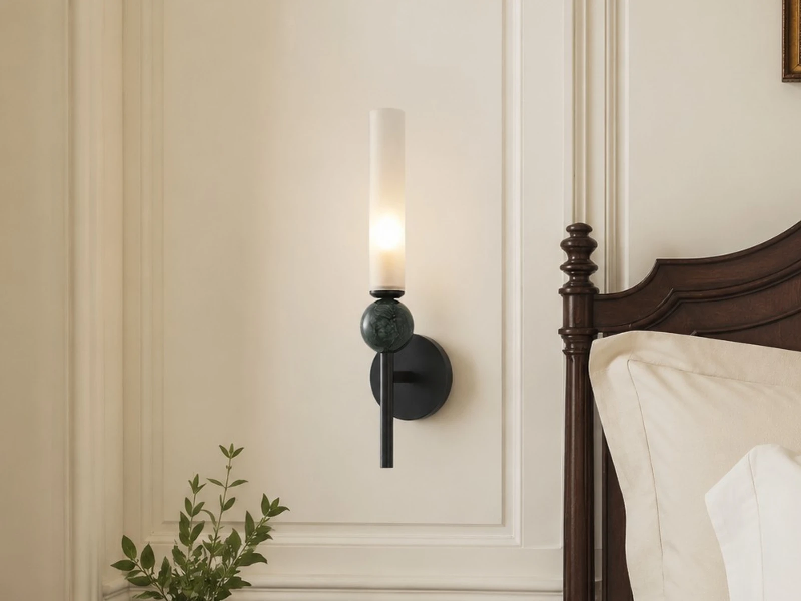 Wall sconce centered in a bedroom scene