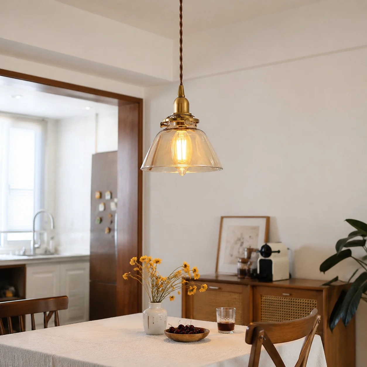 Amber glass pendant above a kitchen table