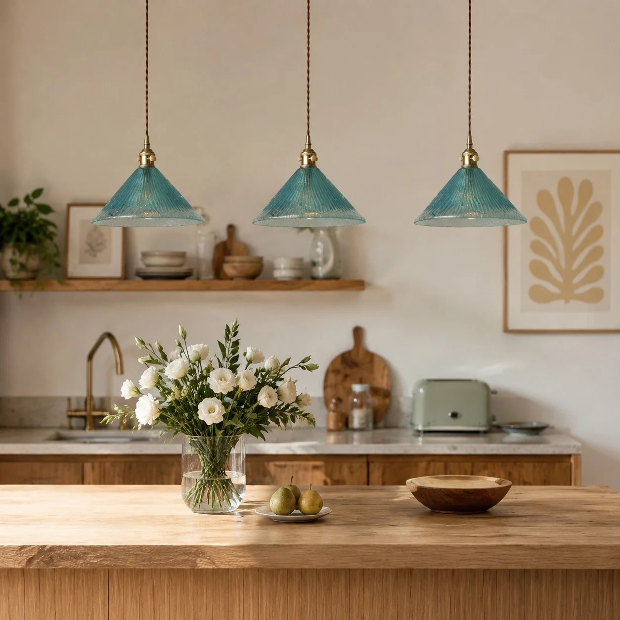 Blue pendant lamps above a kitchen island