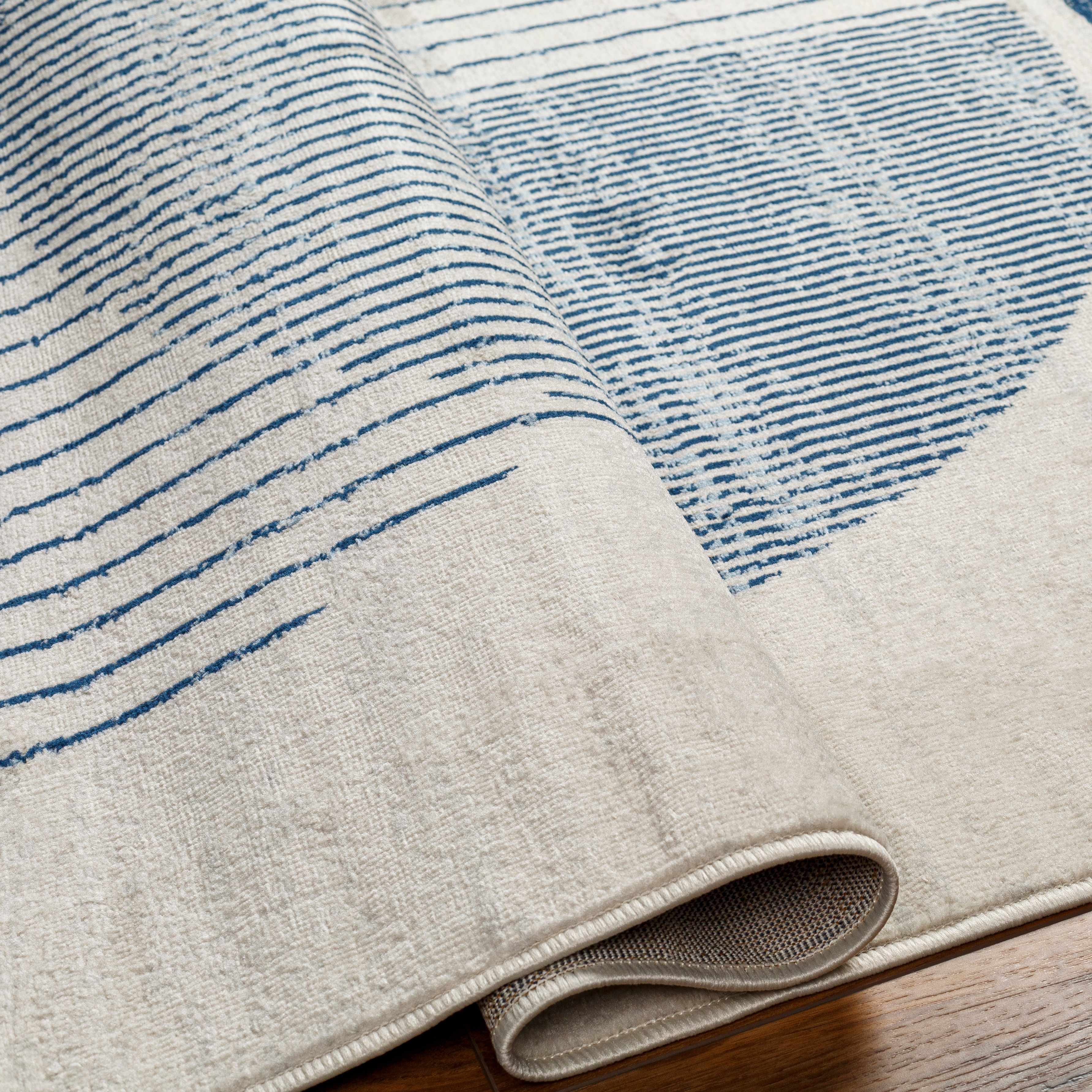 Geometrischer Zeke-Teppich in Wei&szlig; und Blau