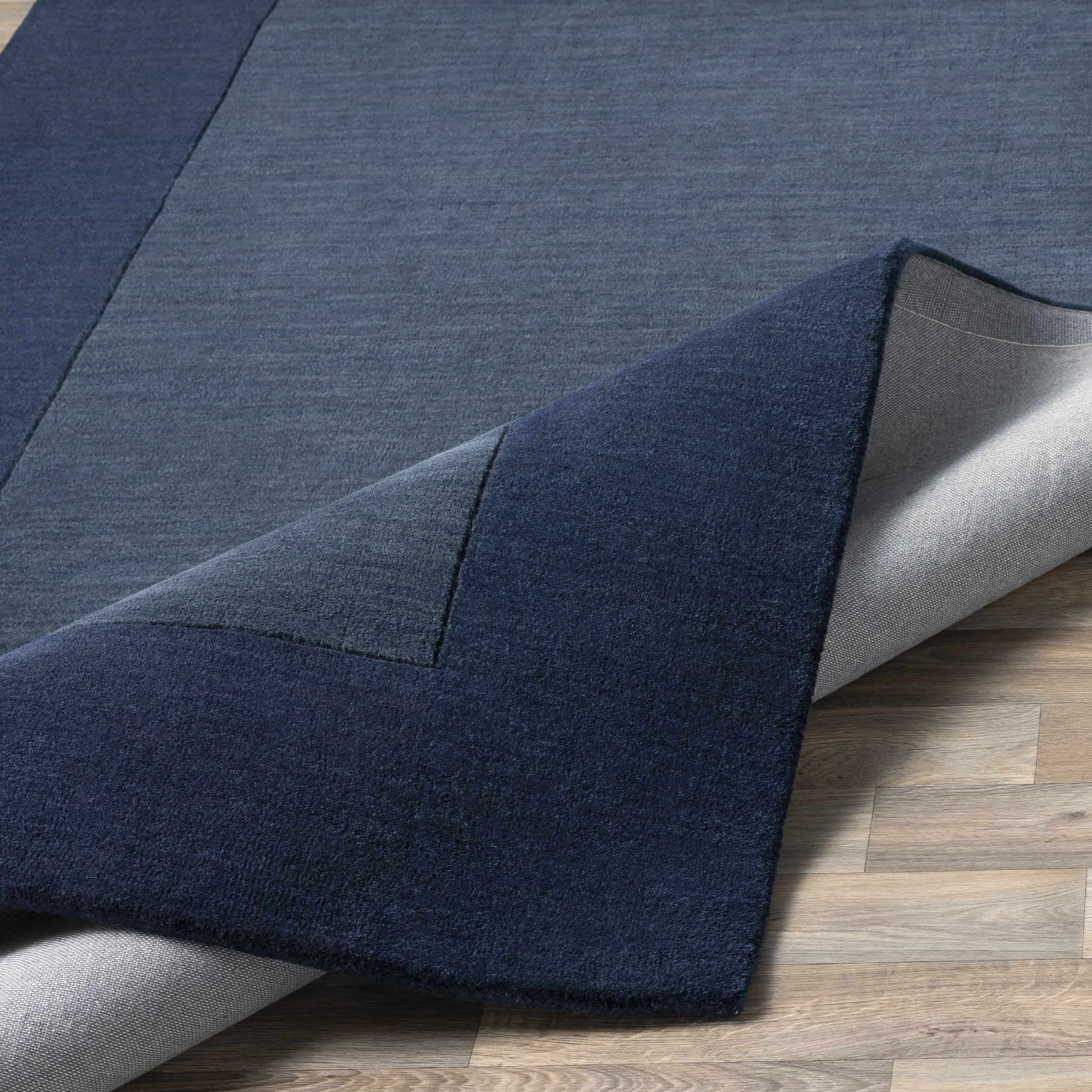 Fingerhut Wollteppich mit blauem Rand