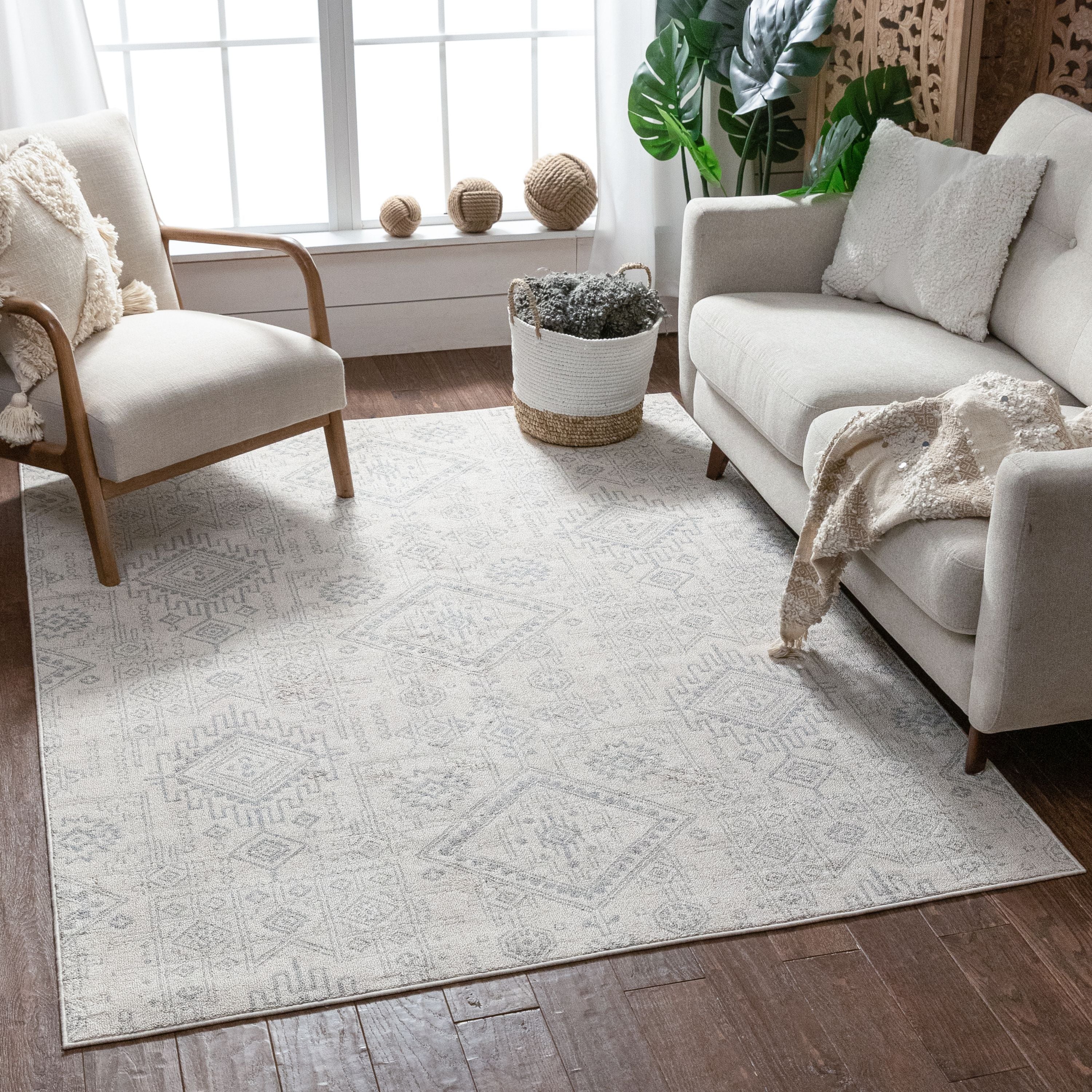 Molly Cremefarbener moderner Ikat-Stammesteppich
