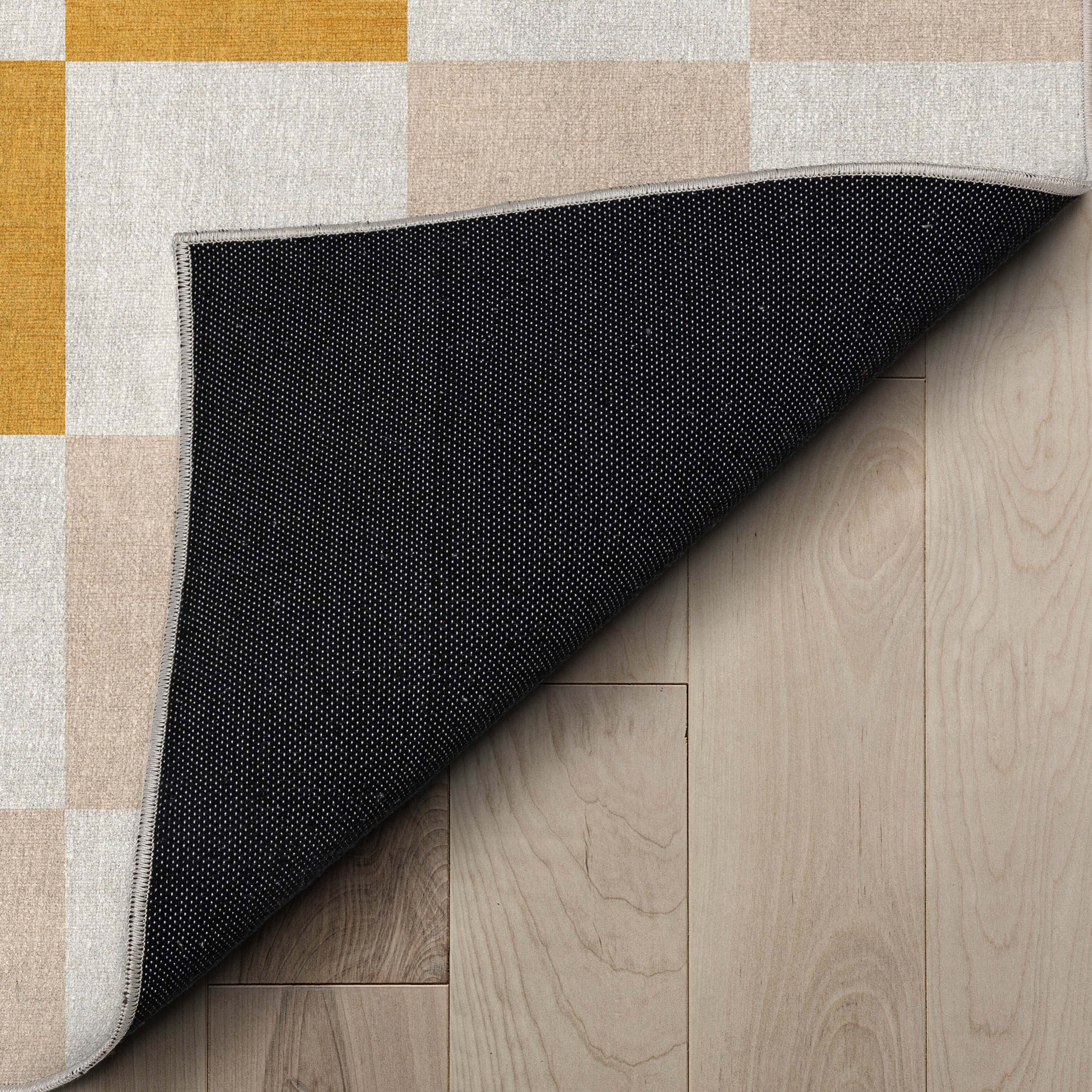 Moderner, mehrfarbig karierter, flach gewebter Kinderteppich &bdquo;Squares&ldquo;.