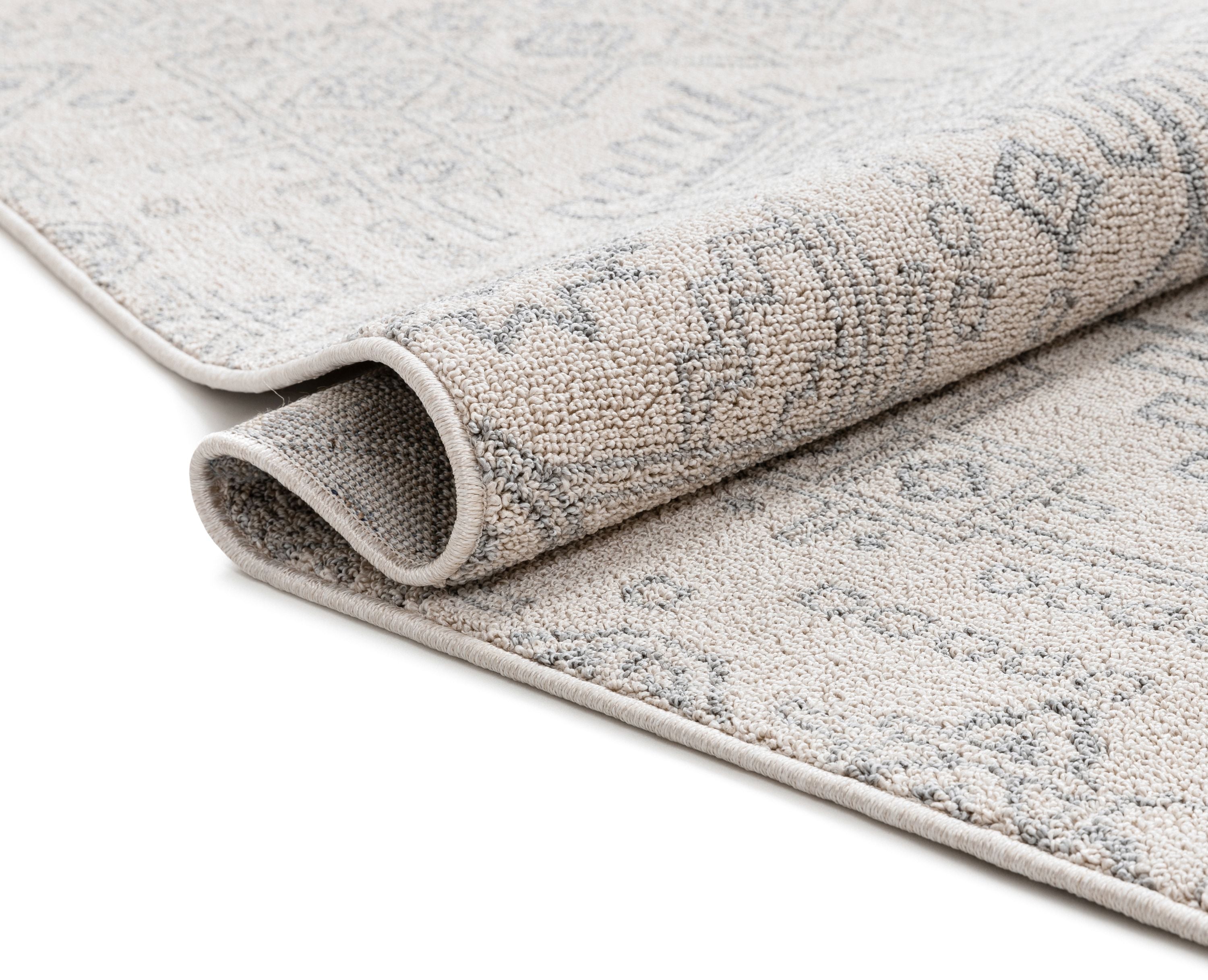 Molly Cremefarbener moderner Ikat-Stammesteppich