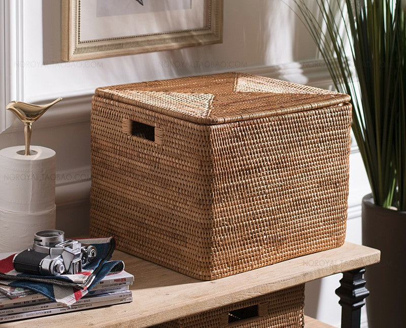 Rectangular woven lidded storage basket with a recessed side handle