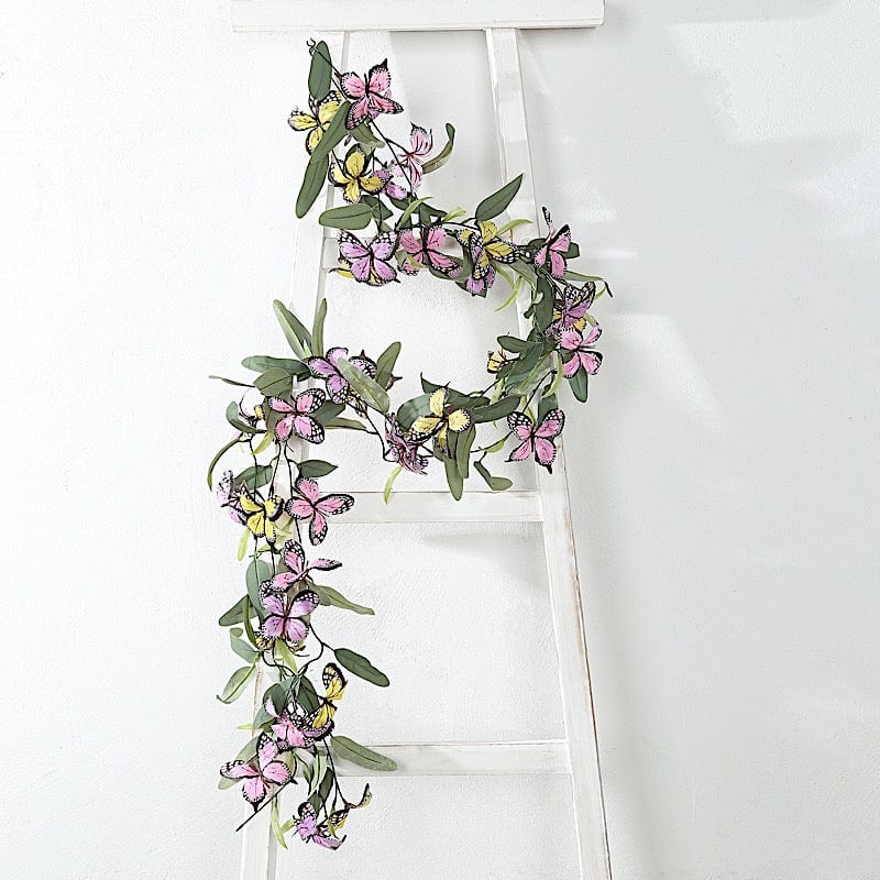 Faux butterfly flower garlands with greenery leaves