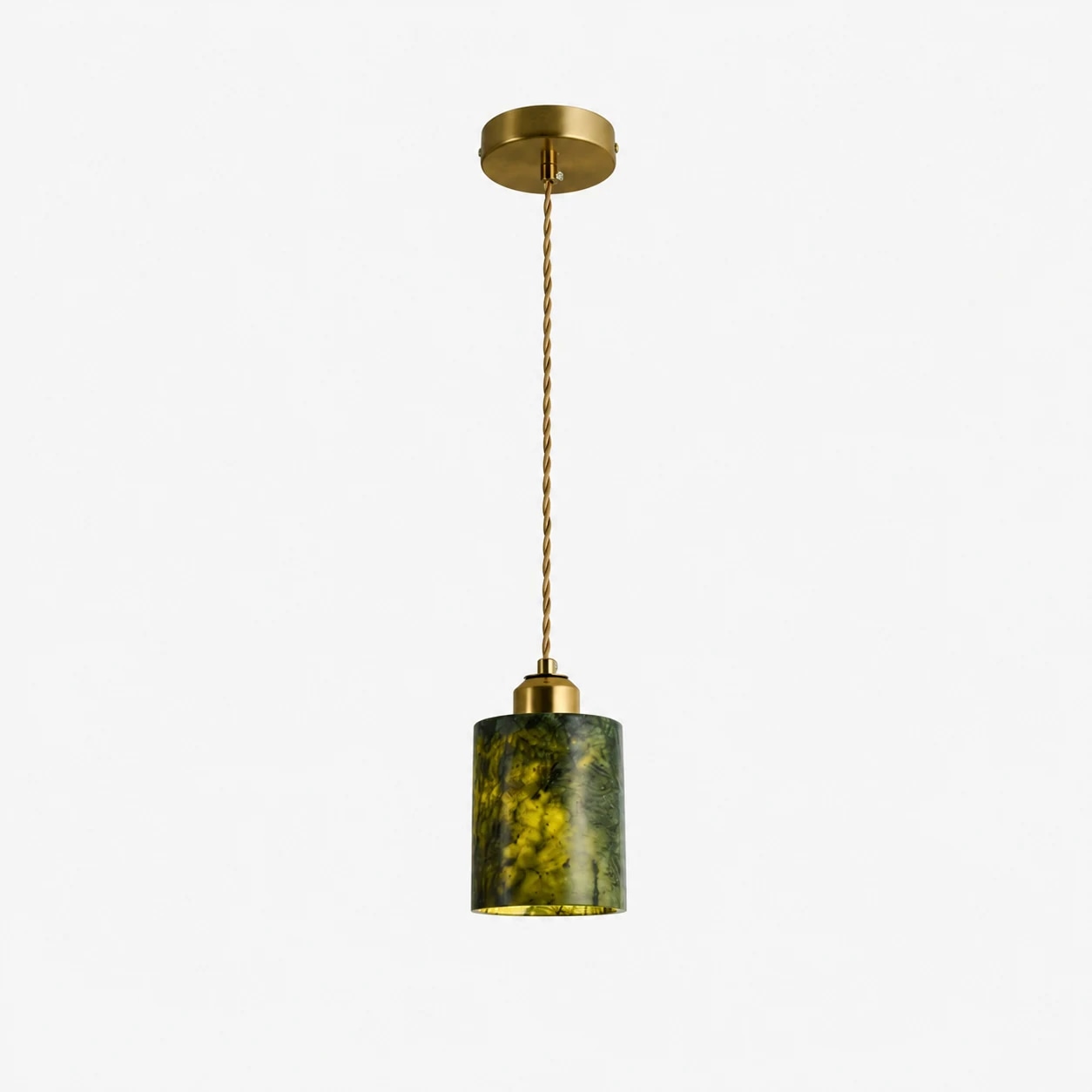 Full view of the single green jade cylinder pendant lamp with cord and brass tone canopy