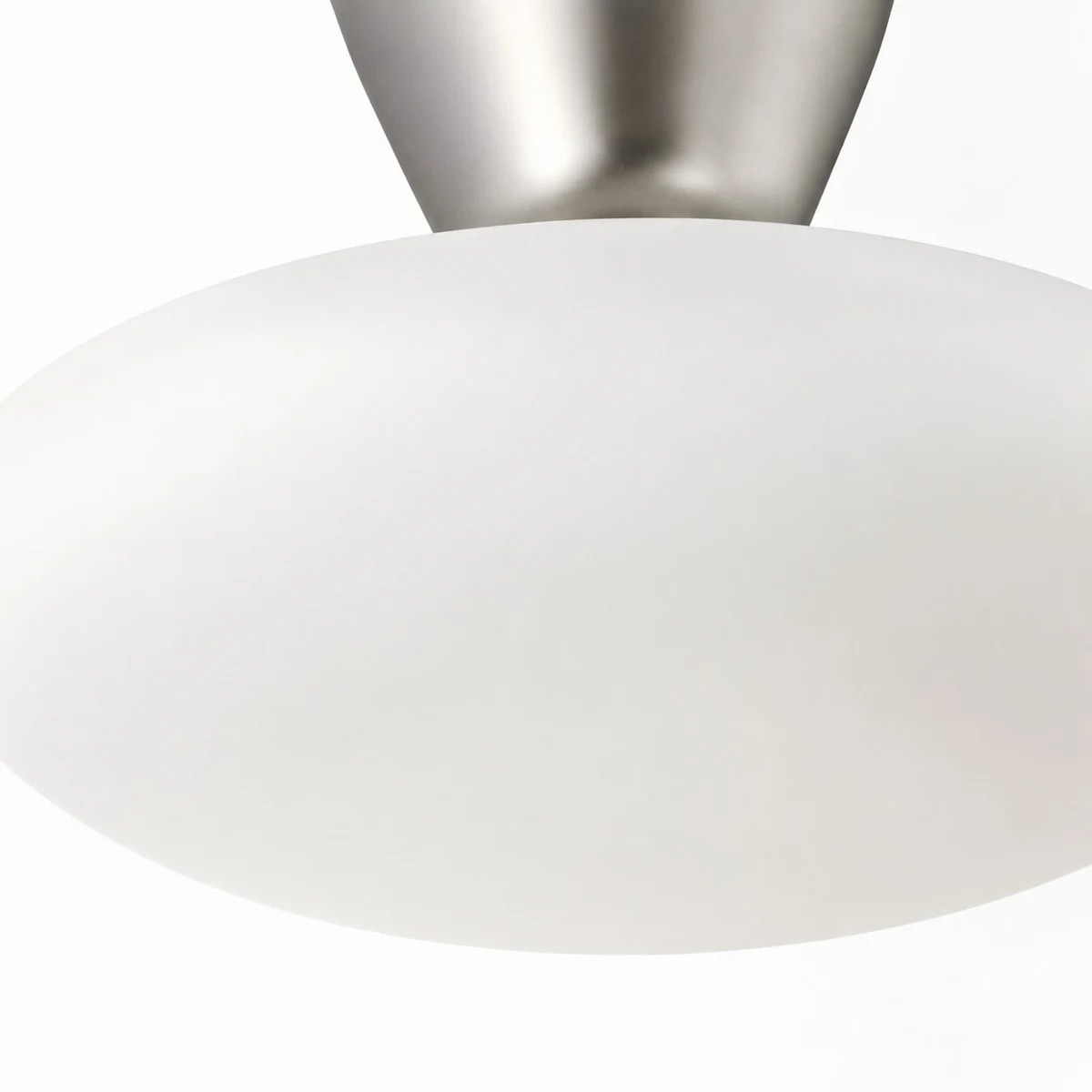White glass diffuser close-up on flush mount ceiling light