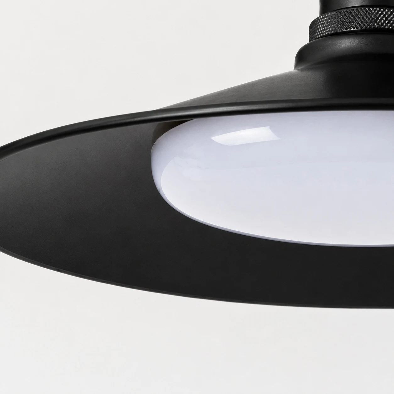 Black metal shade and rounded diffuser detail