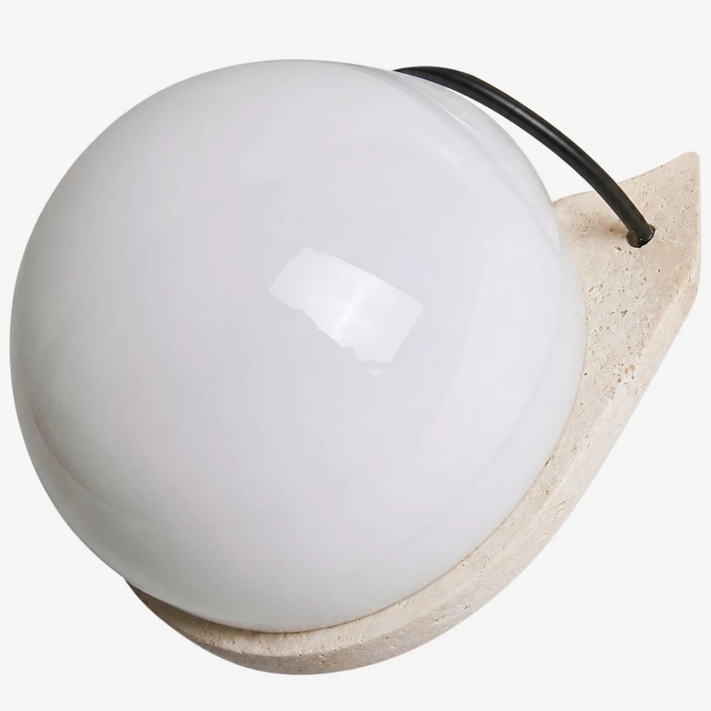 Travertine stone and white glass globe close detail