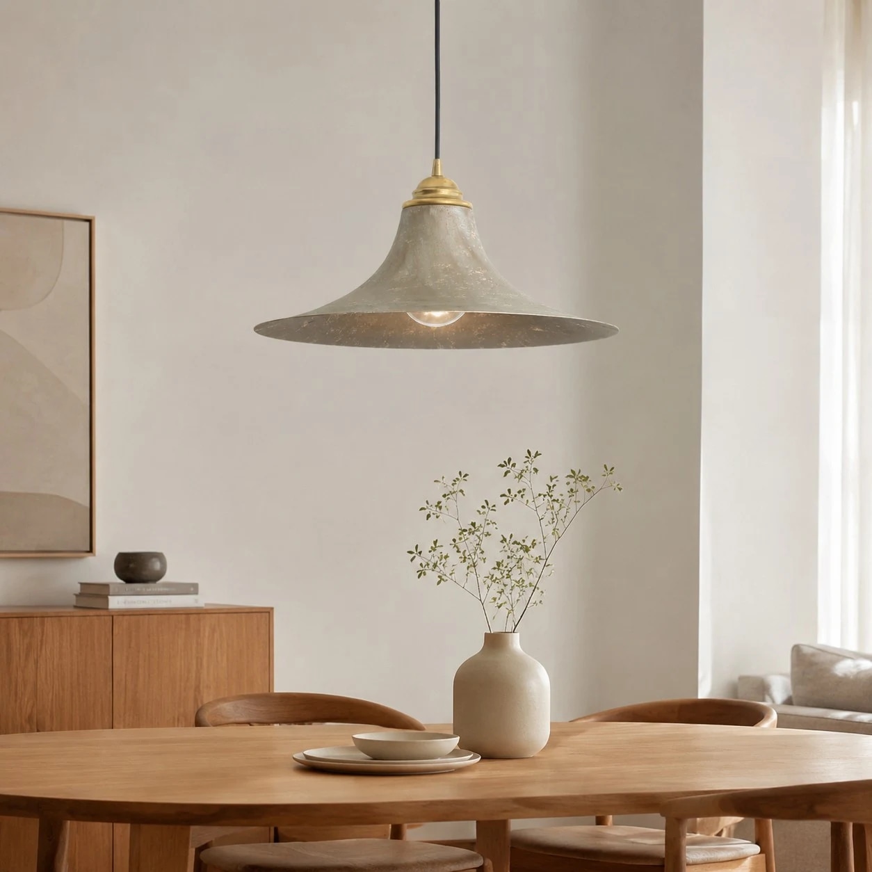 Aged brass pendant light over a dining table