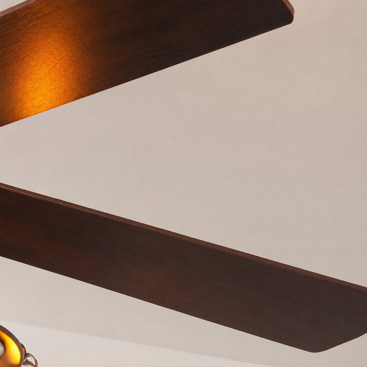 Dark wood ceiling fan blade close detail