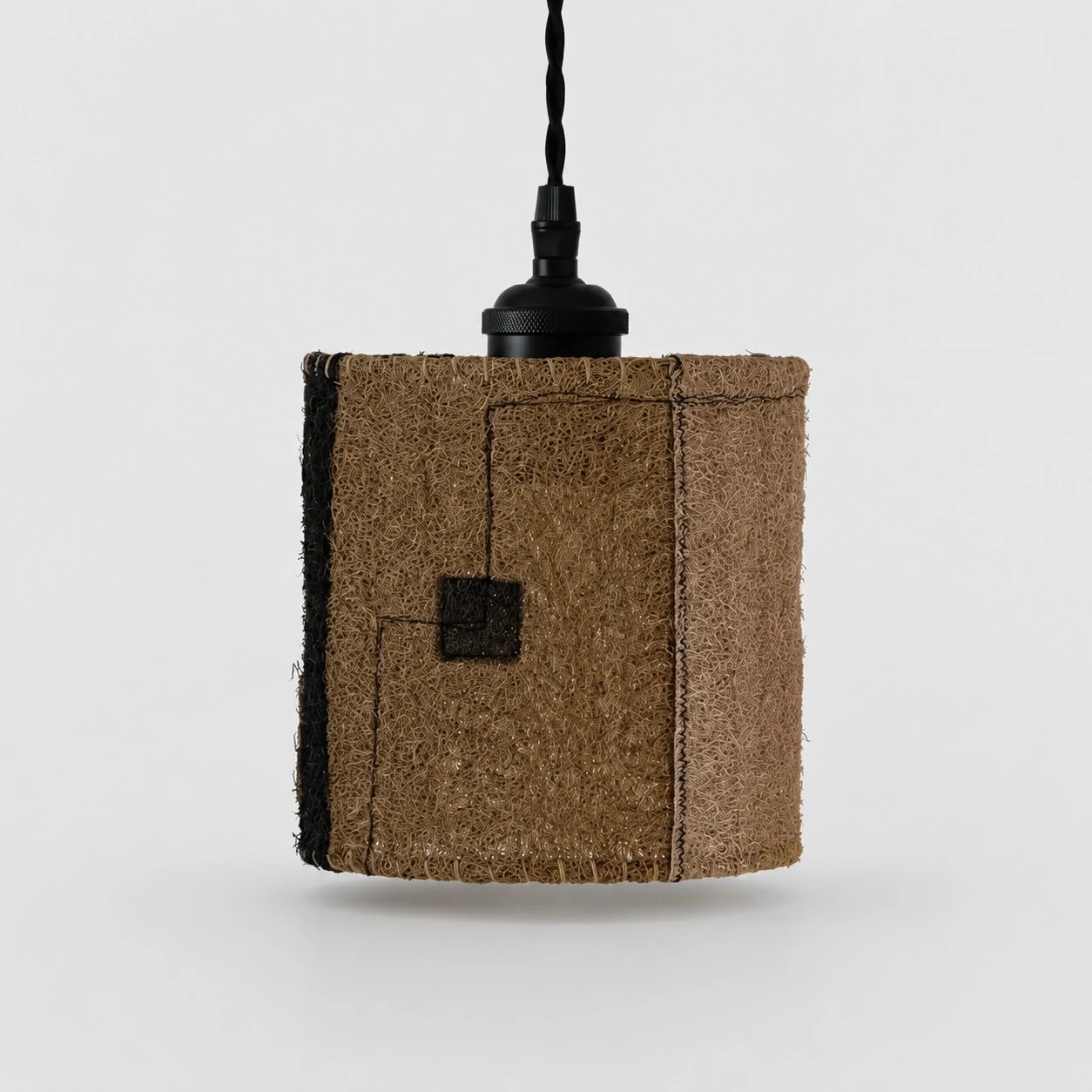 Small natural loofah pendant lamp on white background