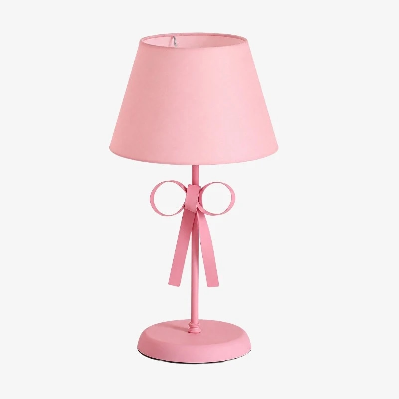 Abajur de mesa com cúpula rosa e corpo da lâmpada também rosa.