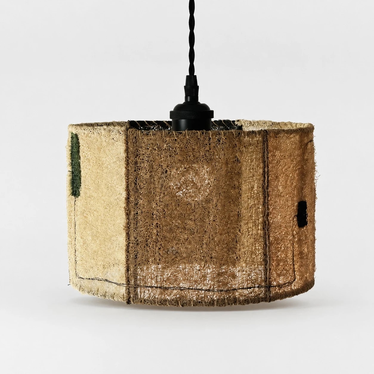 Medium natural loofah pendant lamp on white background