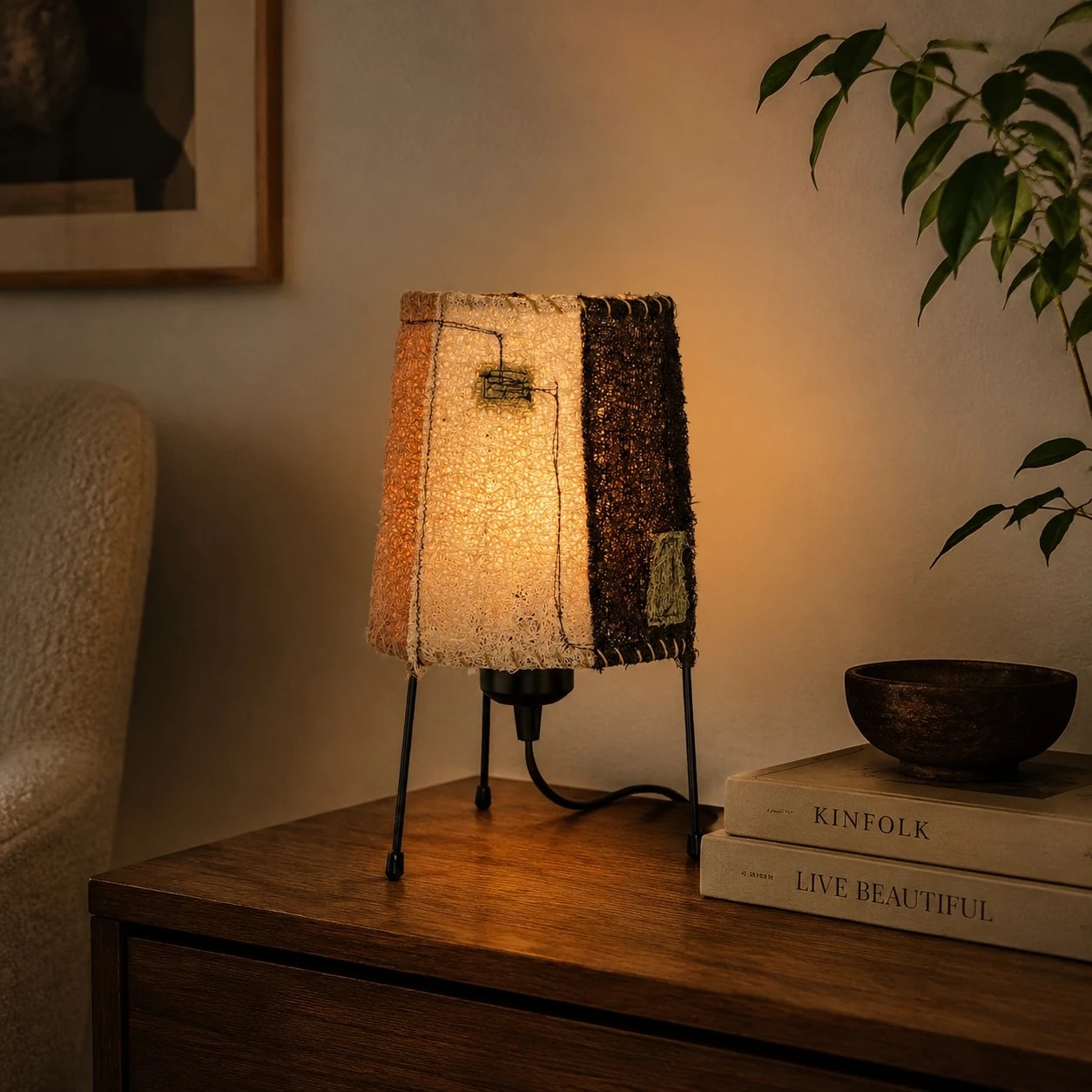Natural woven fiber table lamp glowing on a warm nightstand