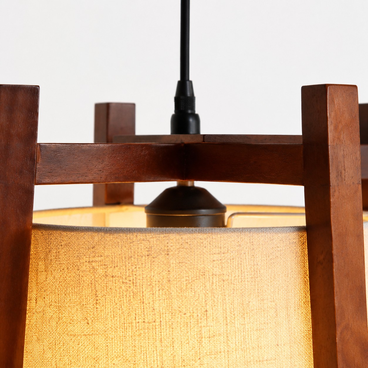 Walnut frame top and black cord close-up