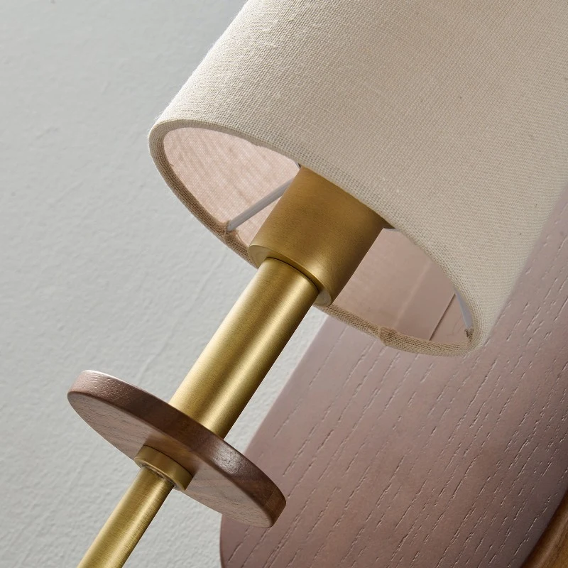 Wood, metal, and fabric in a quiet vertical form