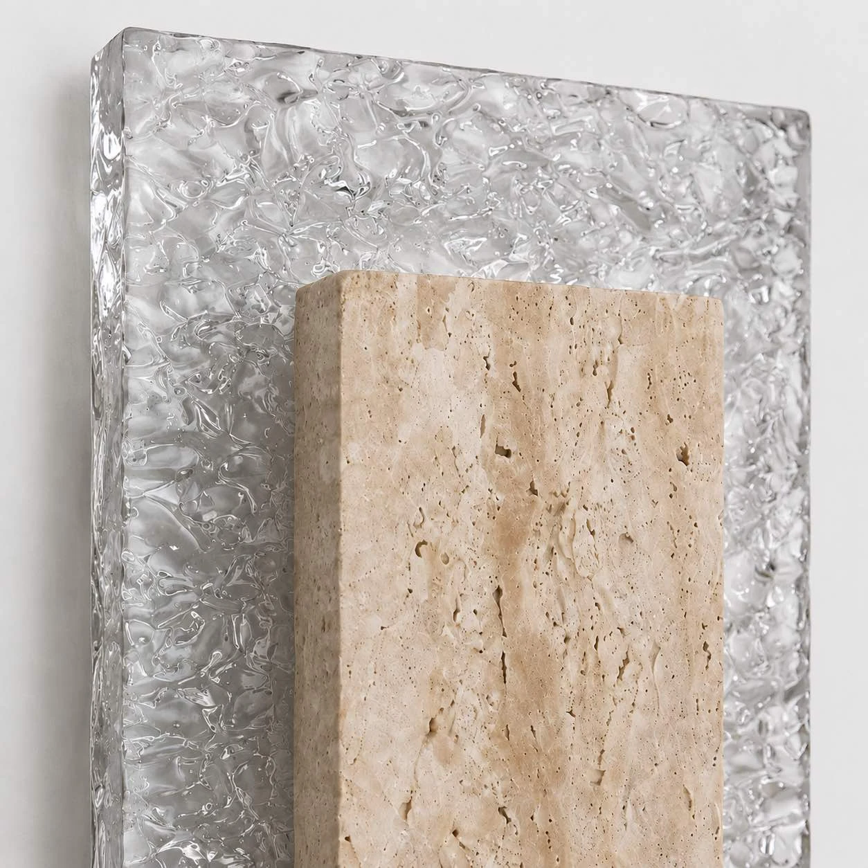 Close view of textured wall lamp panel and translucent back plate