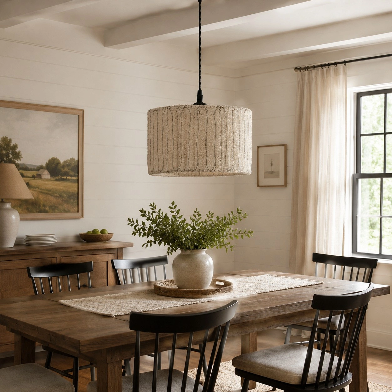 Natural loofah pendant light over a wood dining table