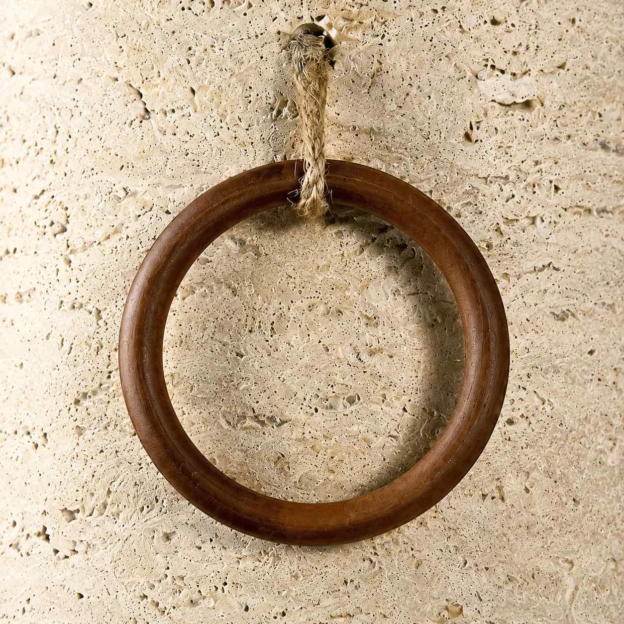 Wood ring and hanging cord detail on the wall light