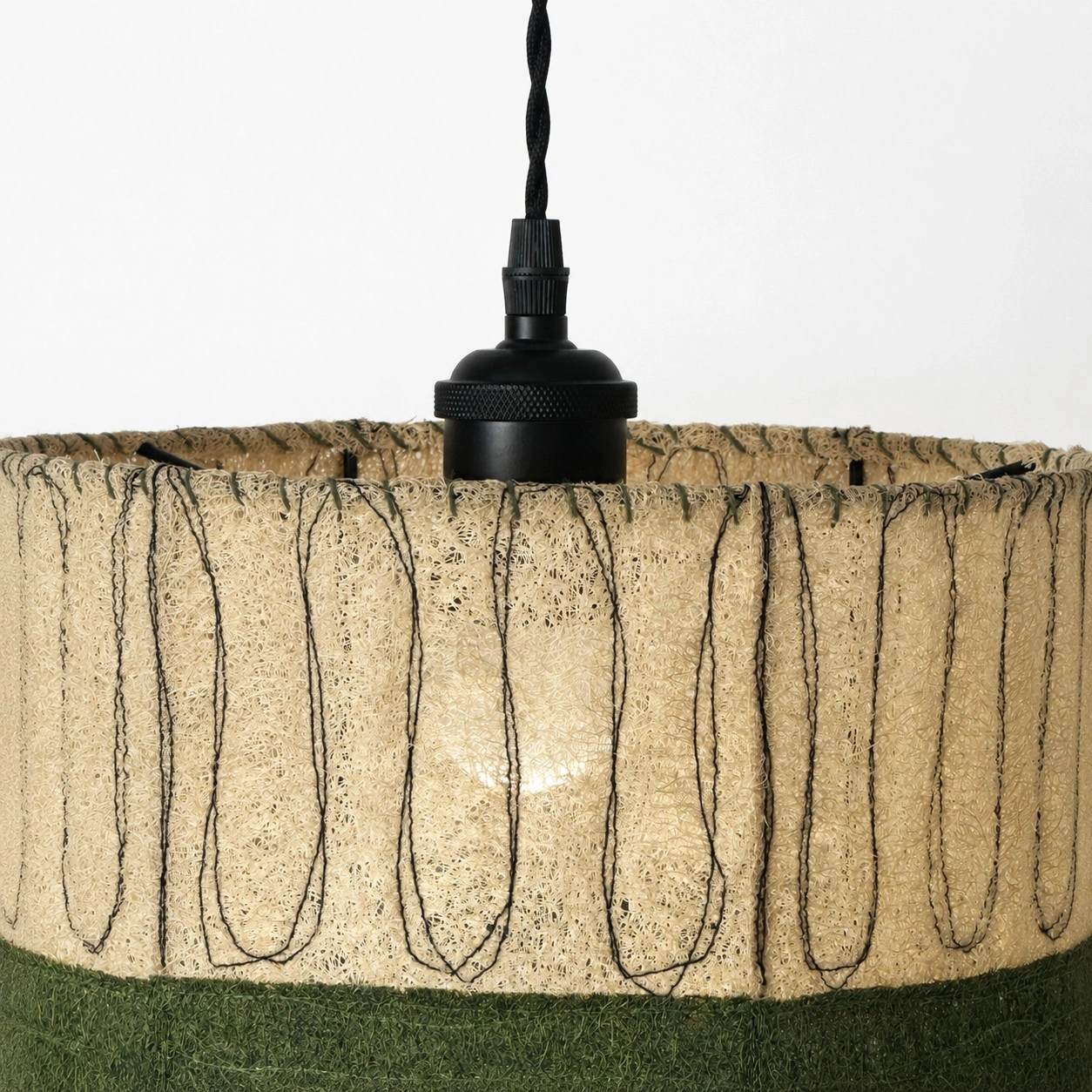 Matte black socket and loofah shade close view