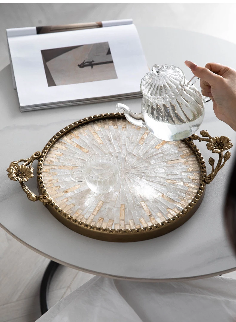 Shell tray used on a vanity table with glassware