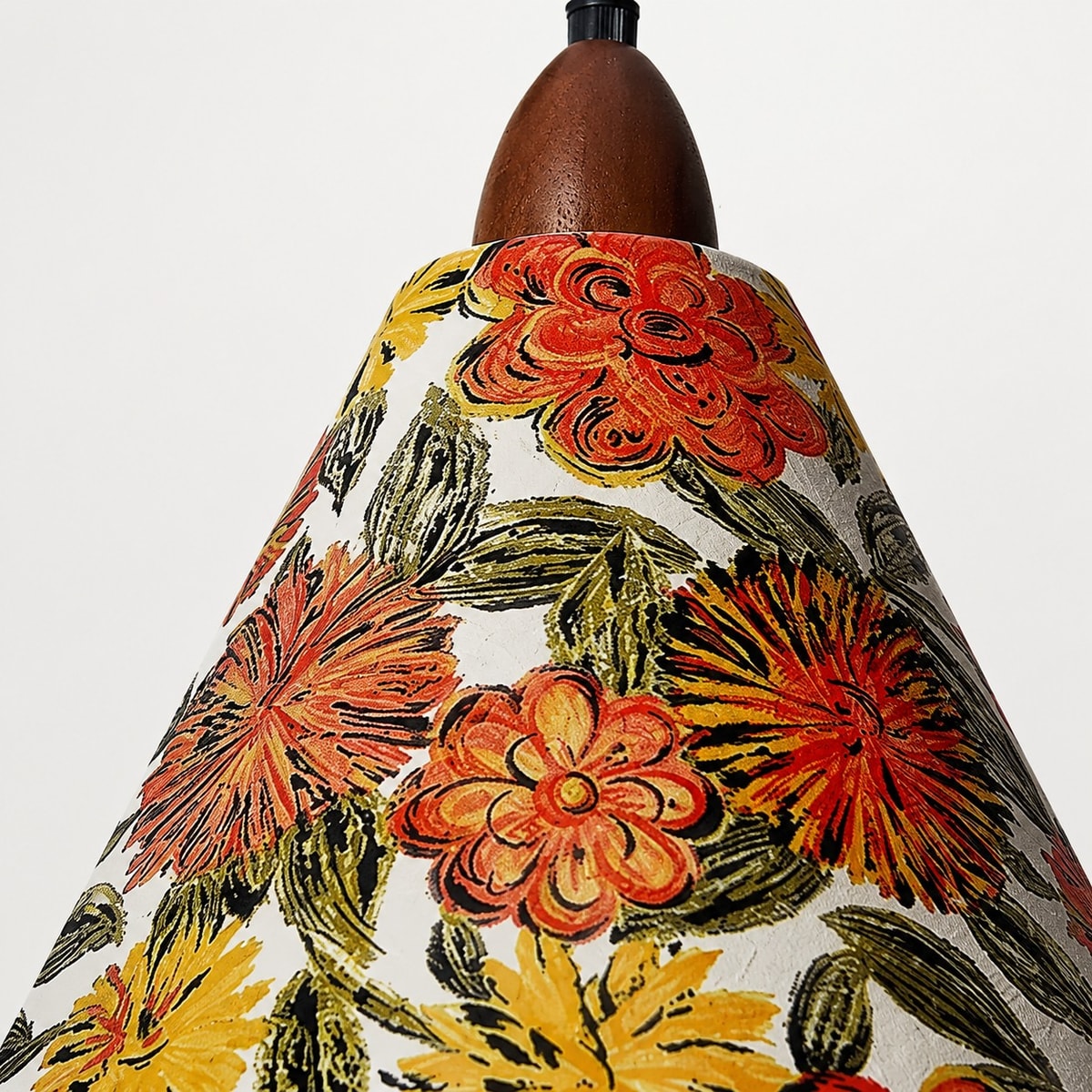 Close view of the floral fabric pendant shade and warm bulb