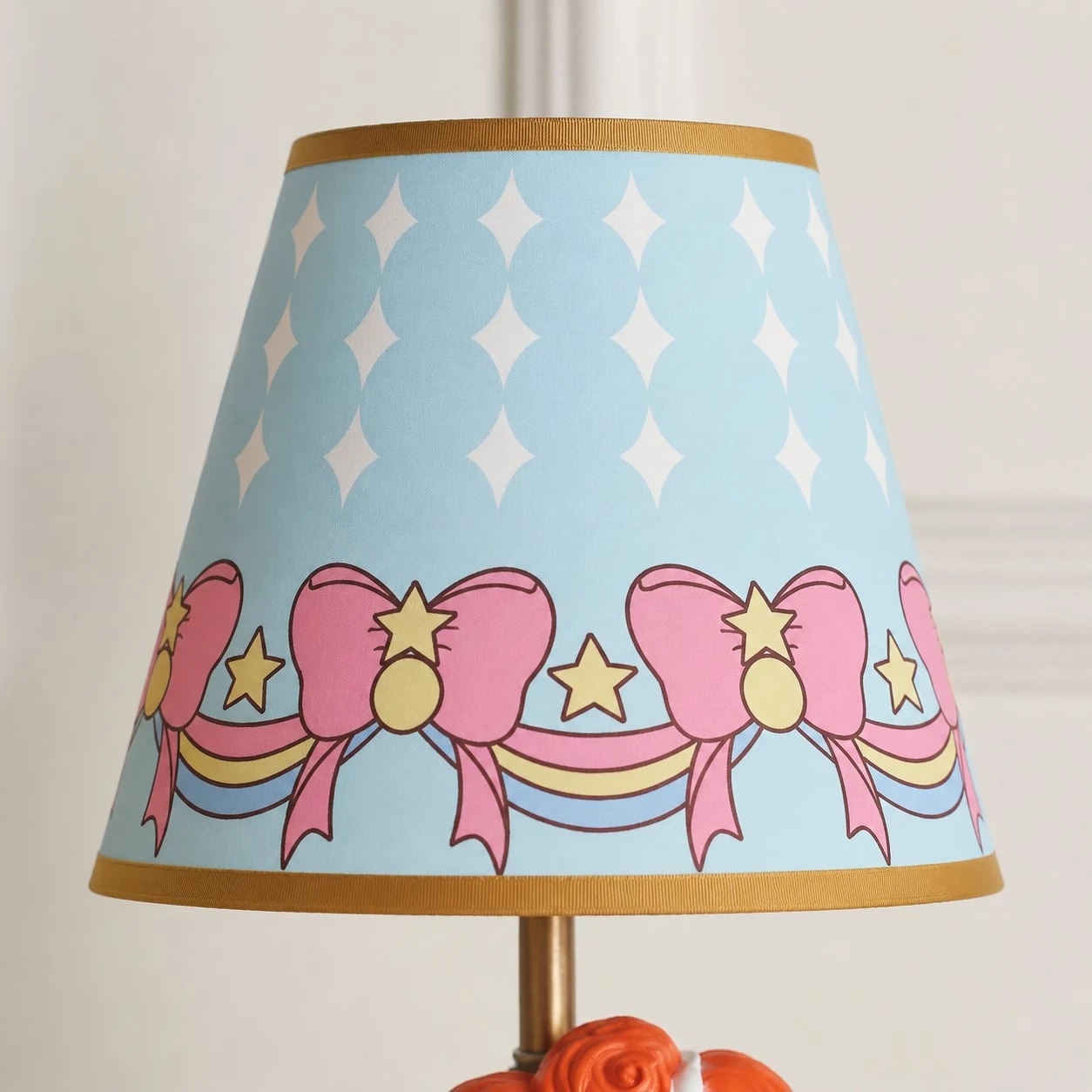 Blue printed fabric shade detail with bows and stars