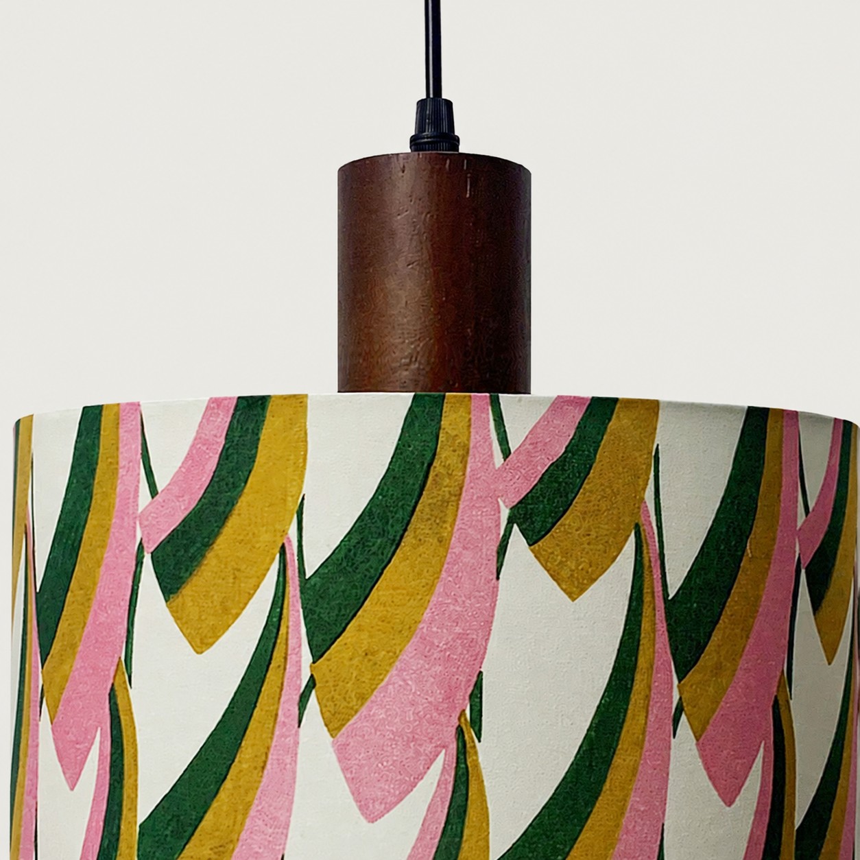 Close view of the printed cotton fabric shade and walnut wood lamp holder