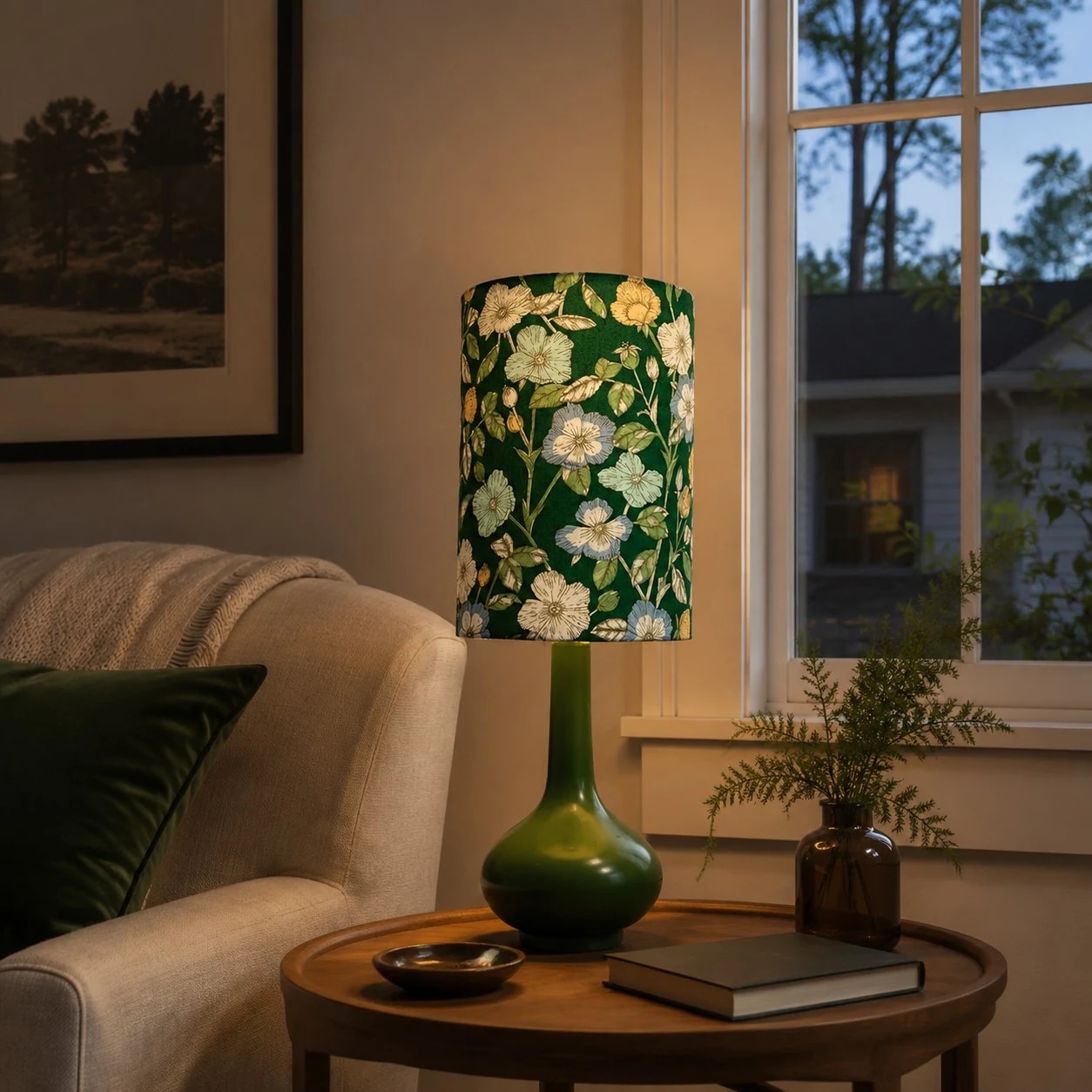 A green ceramic base and floral fabric shade for a calm vintage corner.