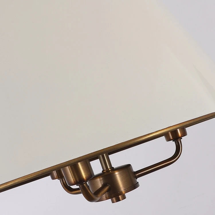Close view of the brass arm structure beneath the shade