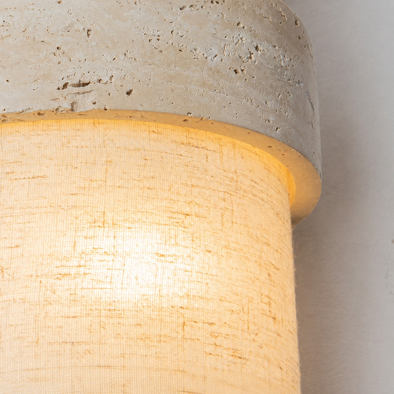 Illuminated travertine and fabric shade texture