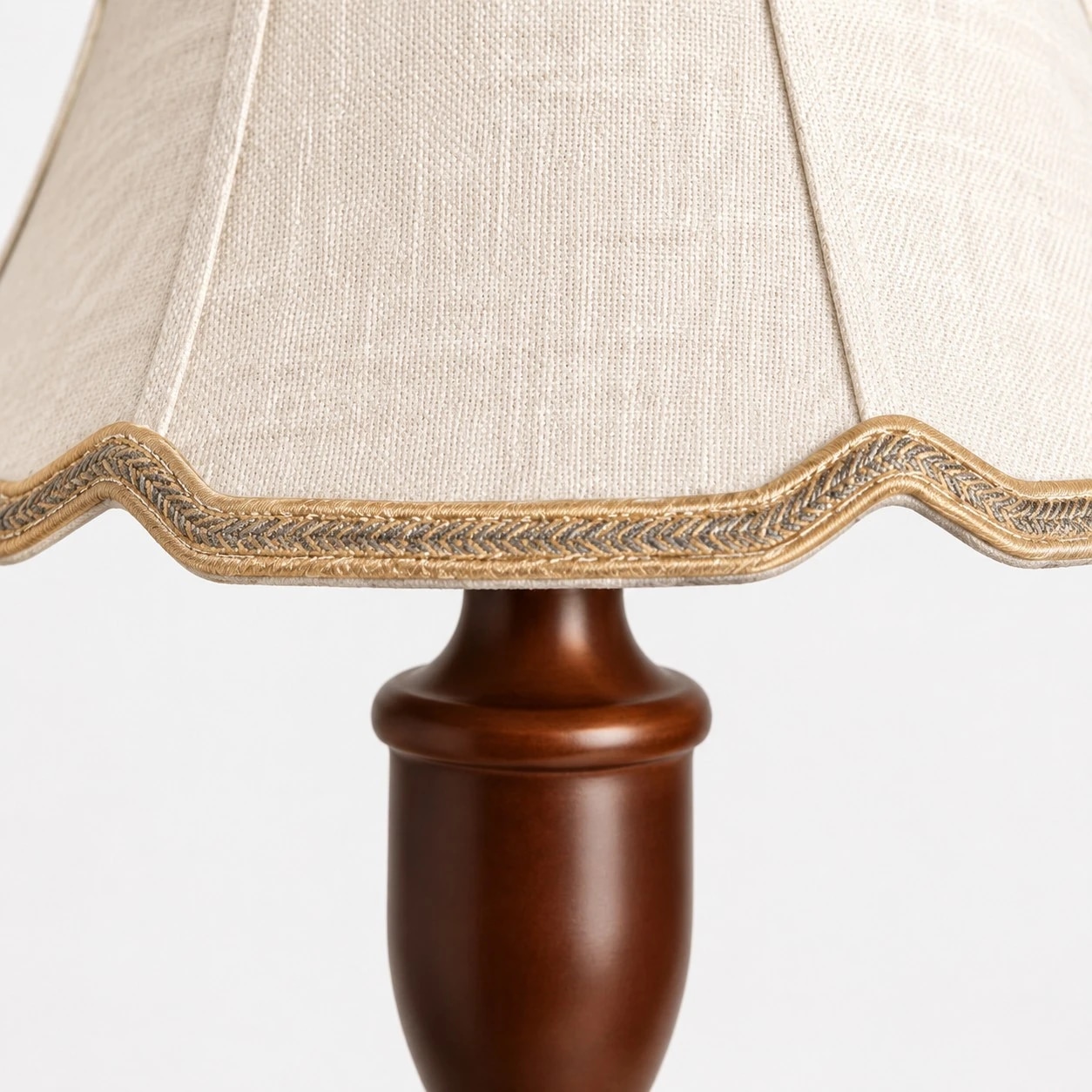 Scalloped fabric shade with braided trim