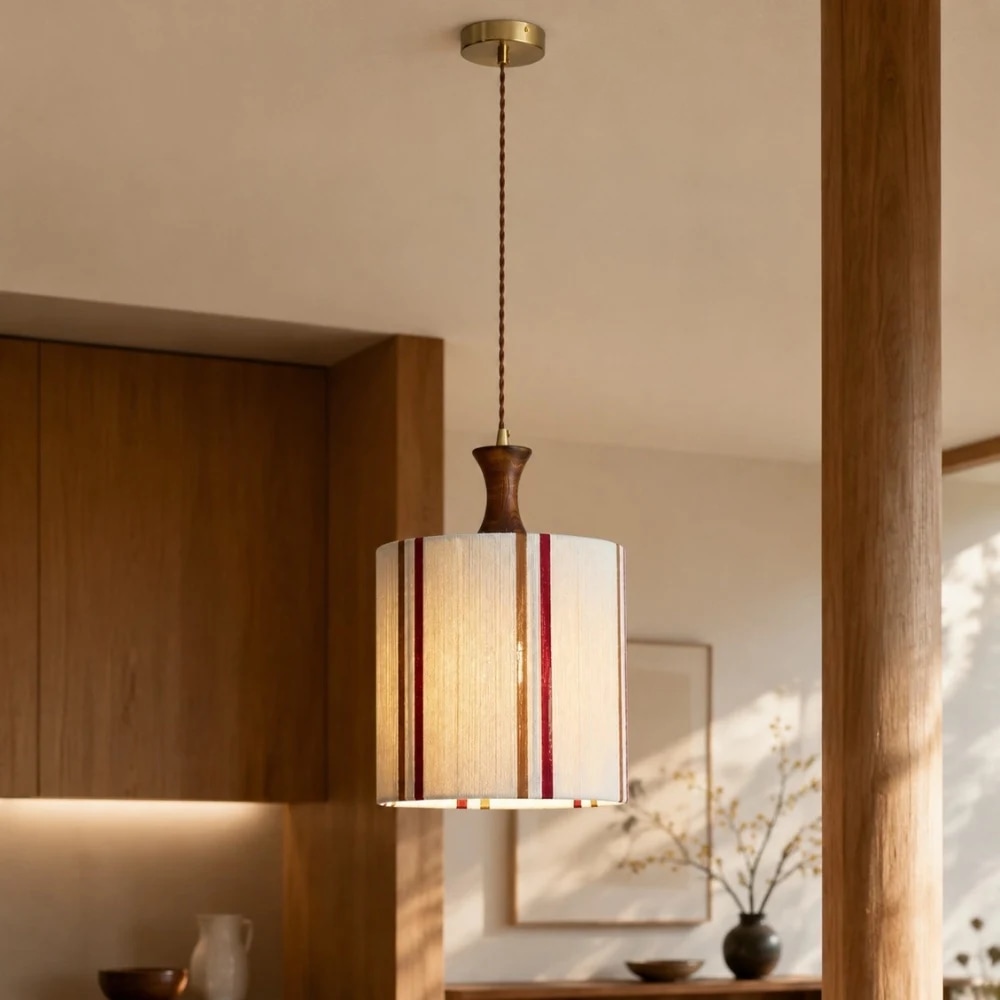 Pendant light installed near a wall and table for scale