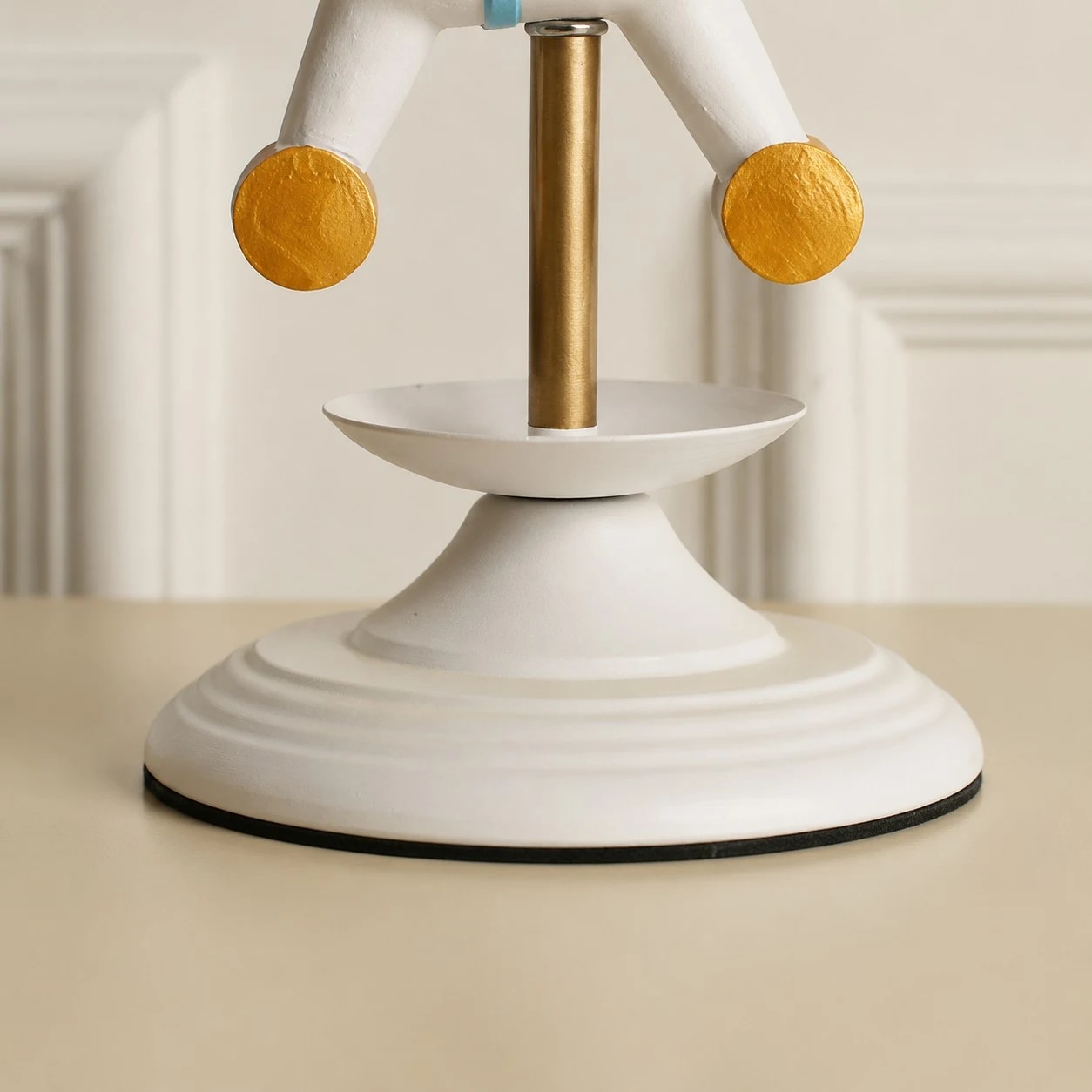 White lamp base and brass stem detail