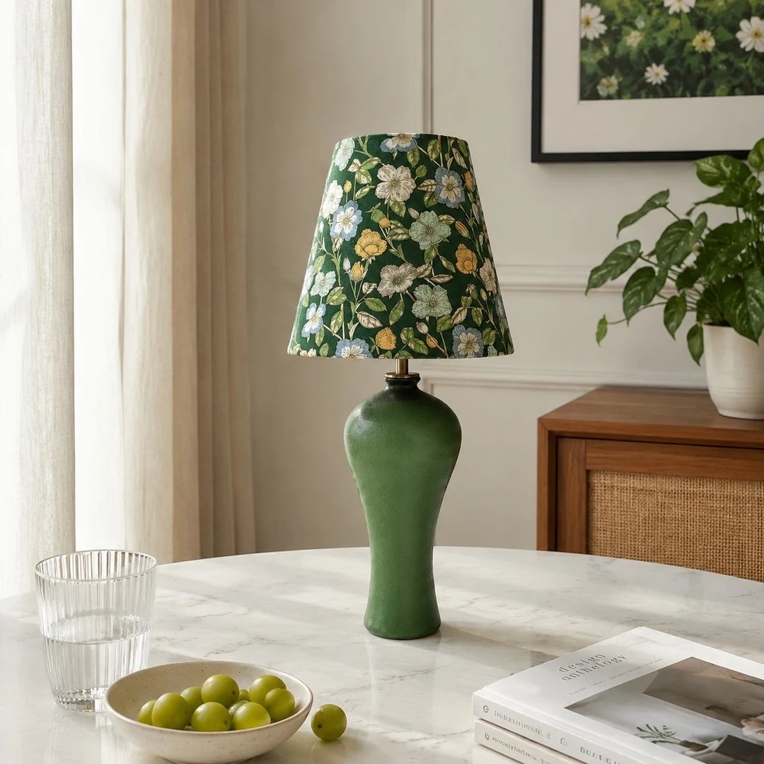 Green floral ceramic table lamp in a dining or console scene