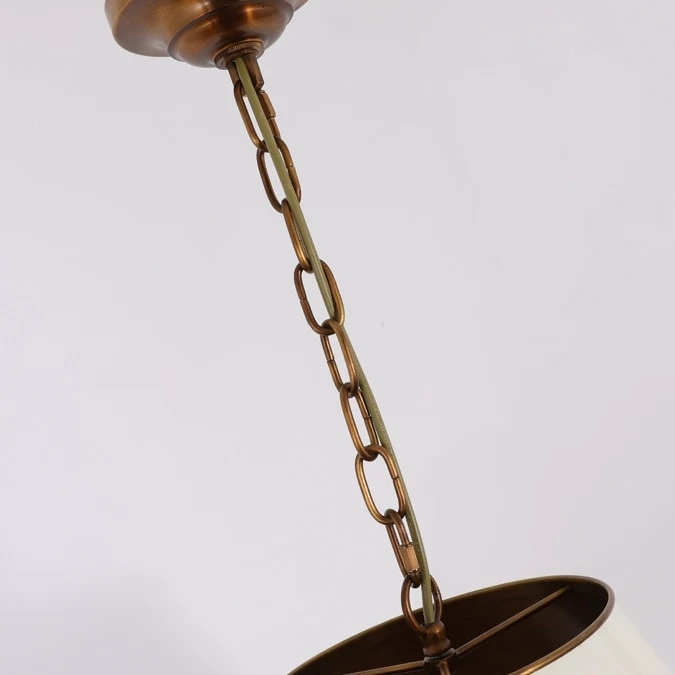 Brass chain and canopy detail on the pendant light
