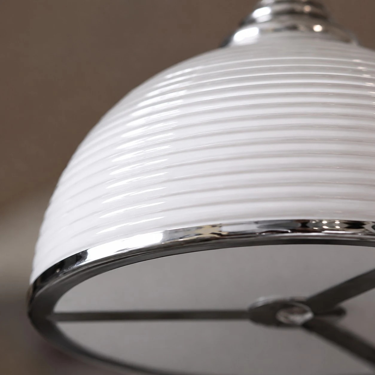 Close detail of the white ribbed shade and lower rim